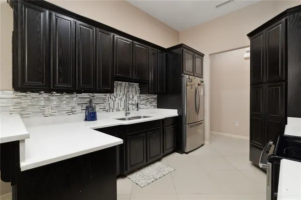 a kitchen with a sink and cabinets