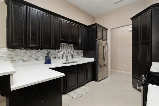 a kitchen with a sink and cabinets