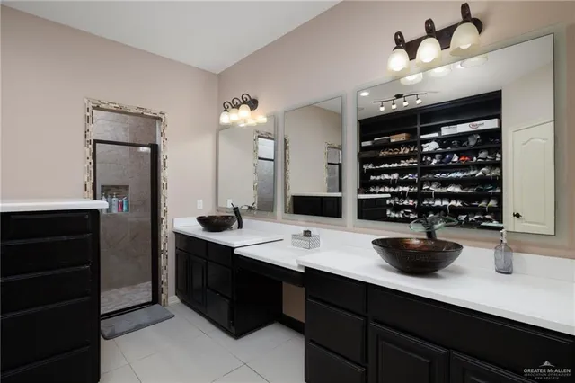 a kitchen with a sink a counter and cabinets