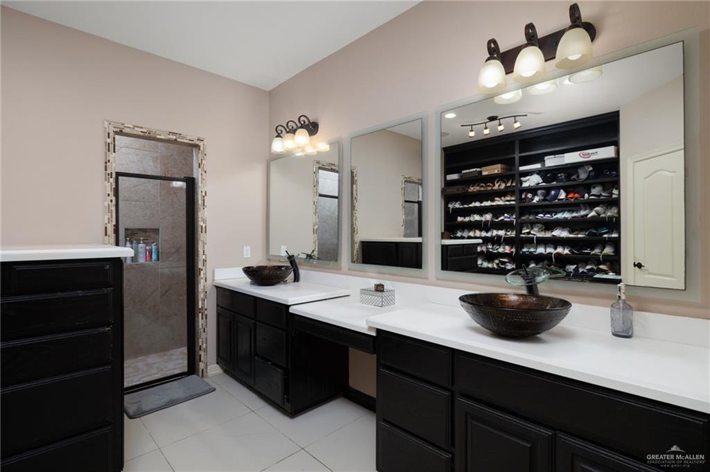 1202 Hummingbird Drive Pharr, TX 78577 - Photo 9 of 23 a kitchen with a sink a counter and cabinets