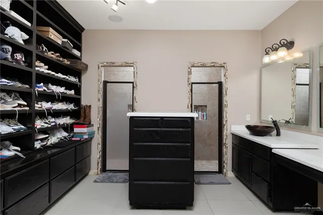 a kitchen with a refrigerator and a stove