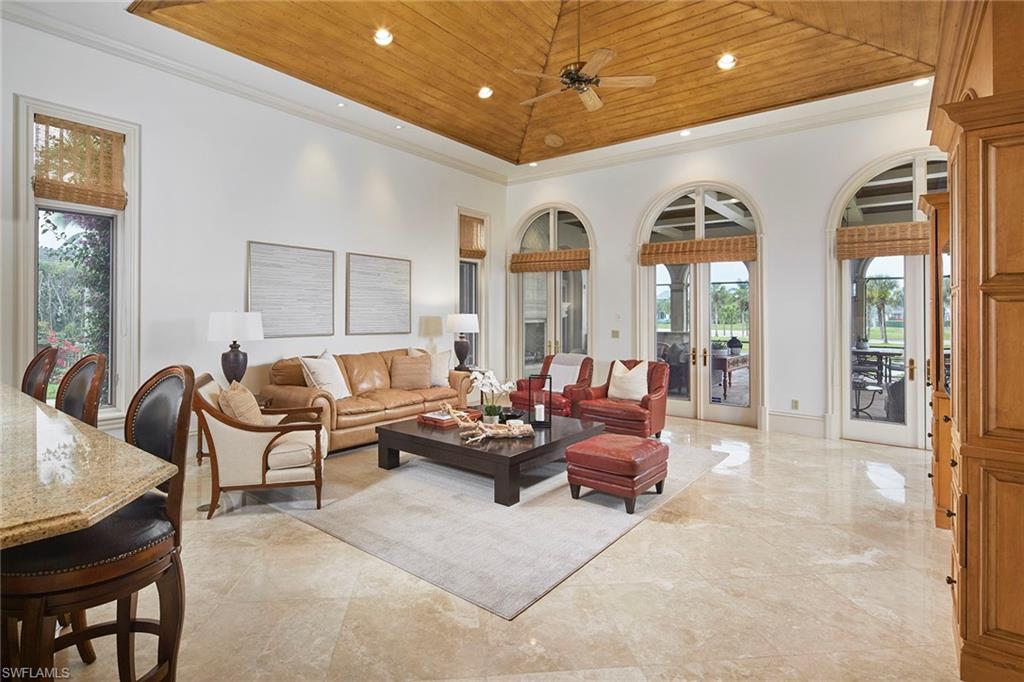 1397 Great Egret Trail Naples, FL 34105 - Photo 18 of 50 a living room with furniture and a large window