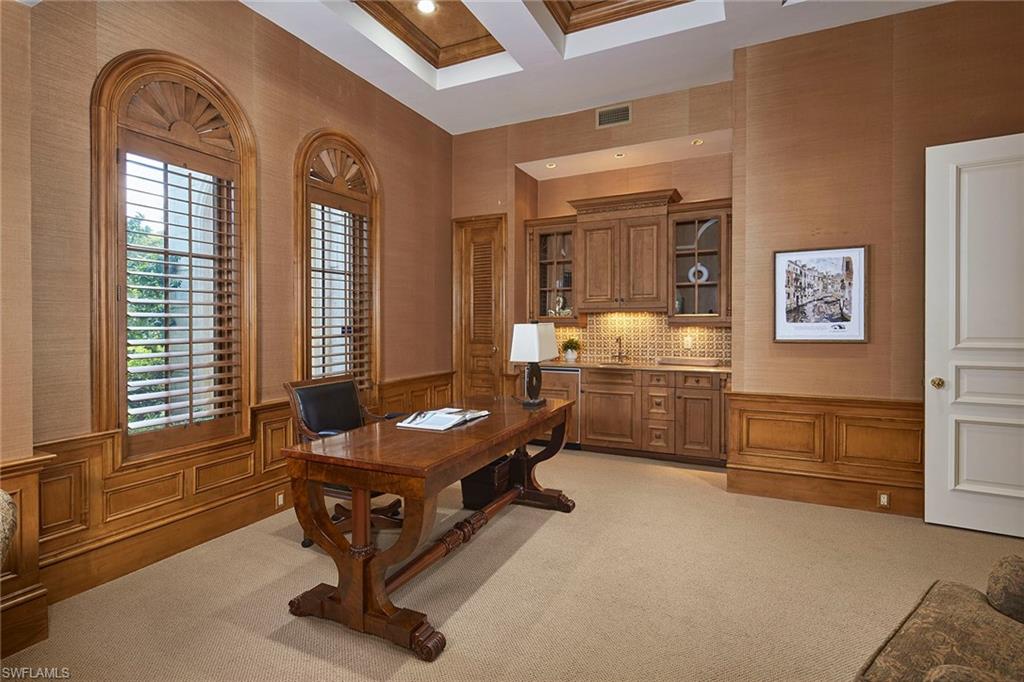 1397 Great Egret Trail Naples, FL 34105 - Photo 25 of 50 a living room with furniture gym equipment and a window