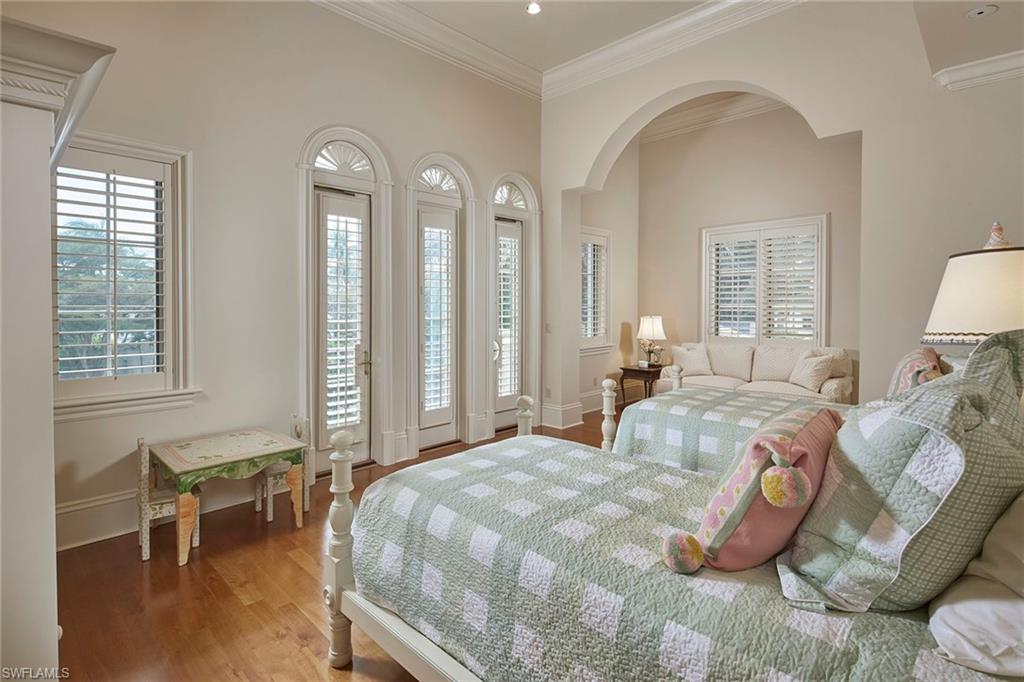 1397 Great Egret Trail Naples, FL 34105 - Photo 29 of 50 a bedroom with bed and a window