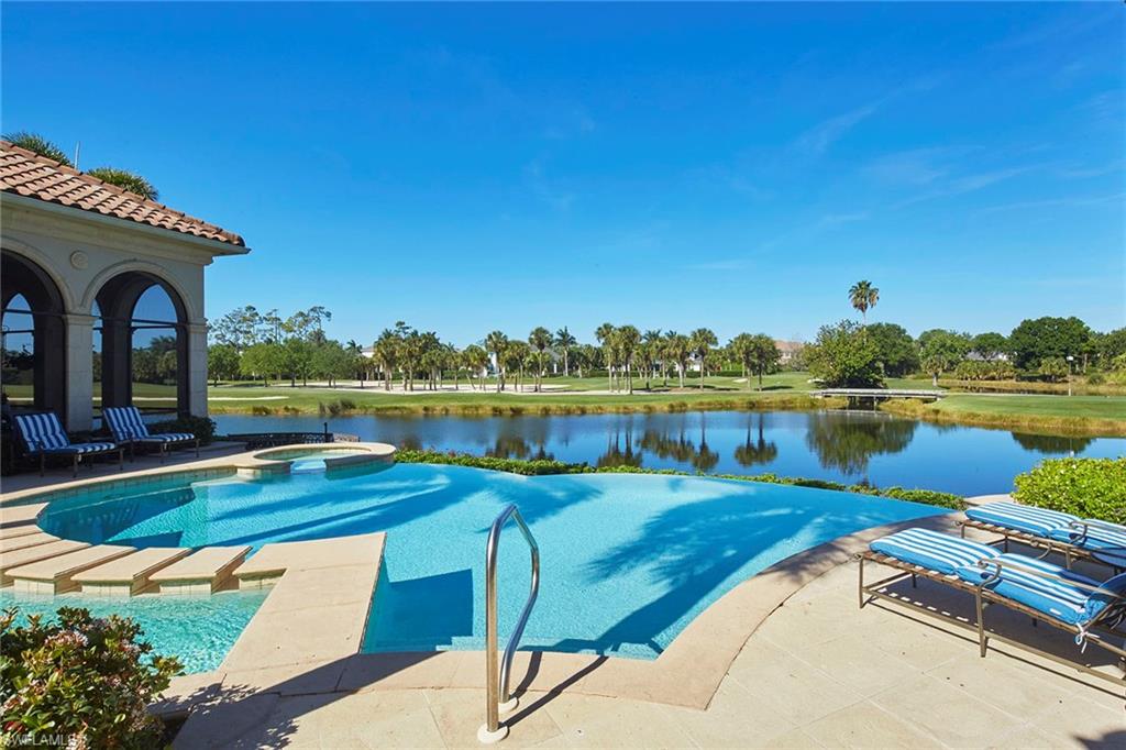 1397 Great Egret Trail Naples, FL 34105 - Photo 39 of 50 a view of swimming pool with outdoor seating and plants