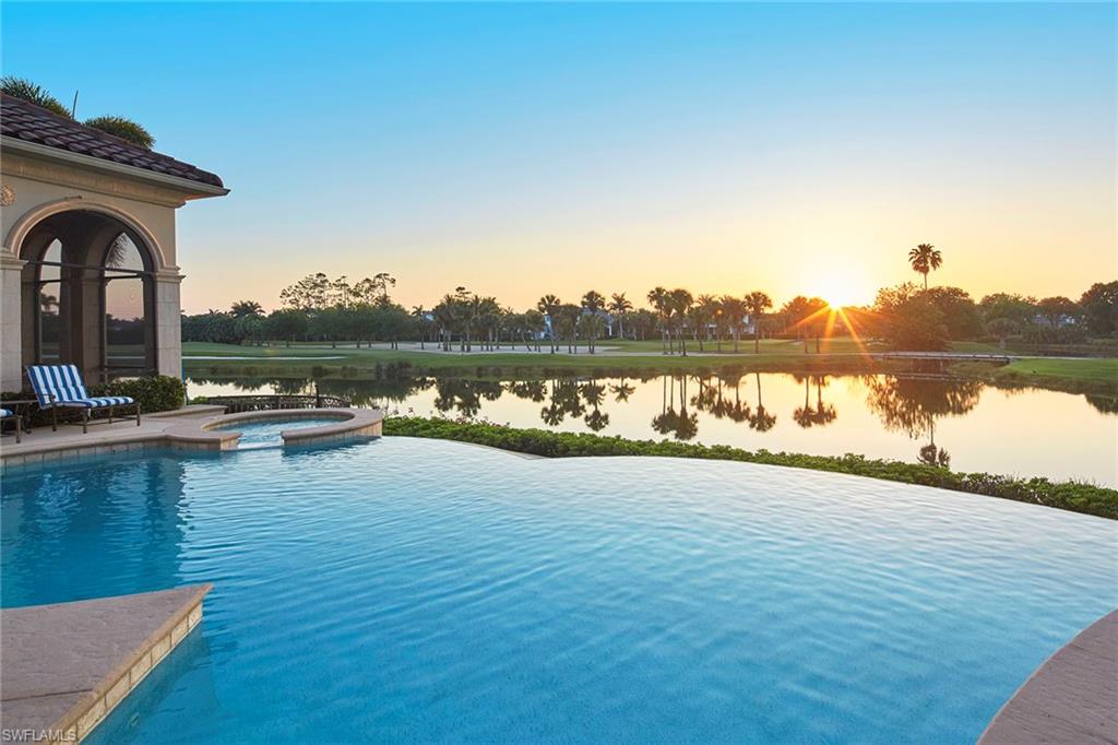 1397 Great Egret Trail Naples, FL 34105 - Photo 4 of 50 a view of a lake with houses in the back