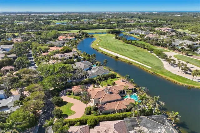an aerial view of a city with lake view