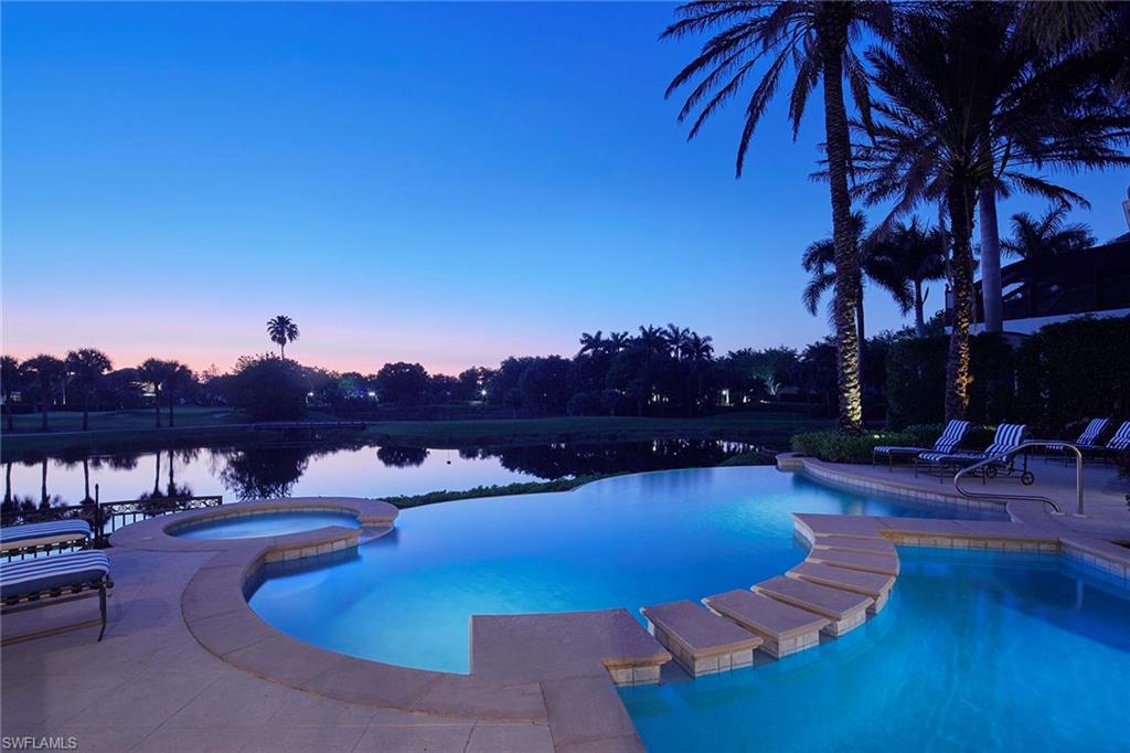 1397 Great Egret Trail Naples, FL 34105 - Photo 49 of 50 a view of a swimming pool with lounge chairs