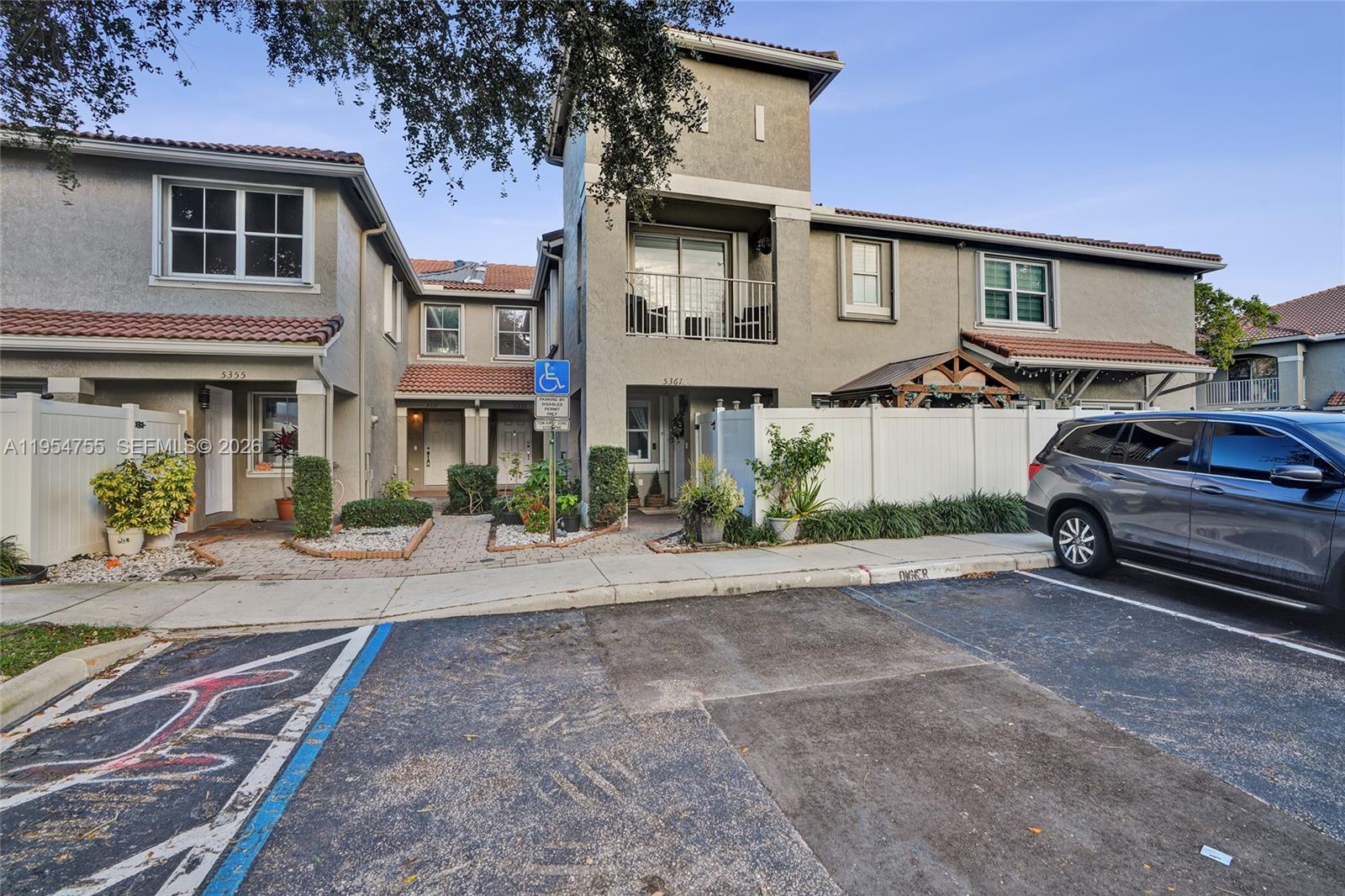 5361 Southwest 125th Avenue Miramar, FL 33027 - Photo 25 of 38 a car parked in front of a brick house