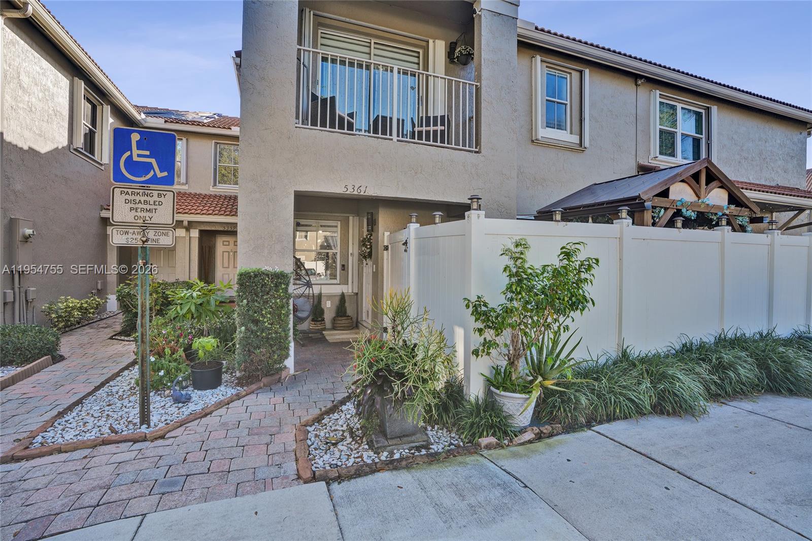 5361 Southwest 125th Avenue Miramar, FL 33027 - Photo 28 of 38 a front view of a house with garden