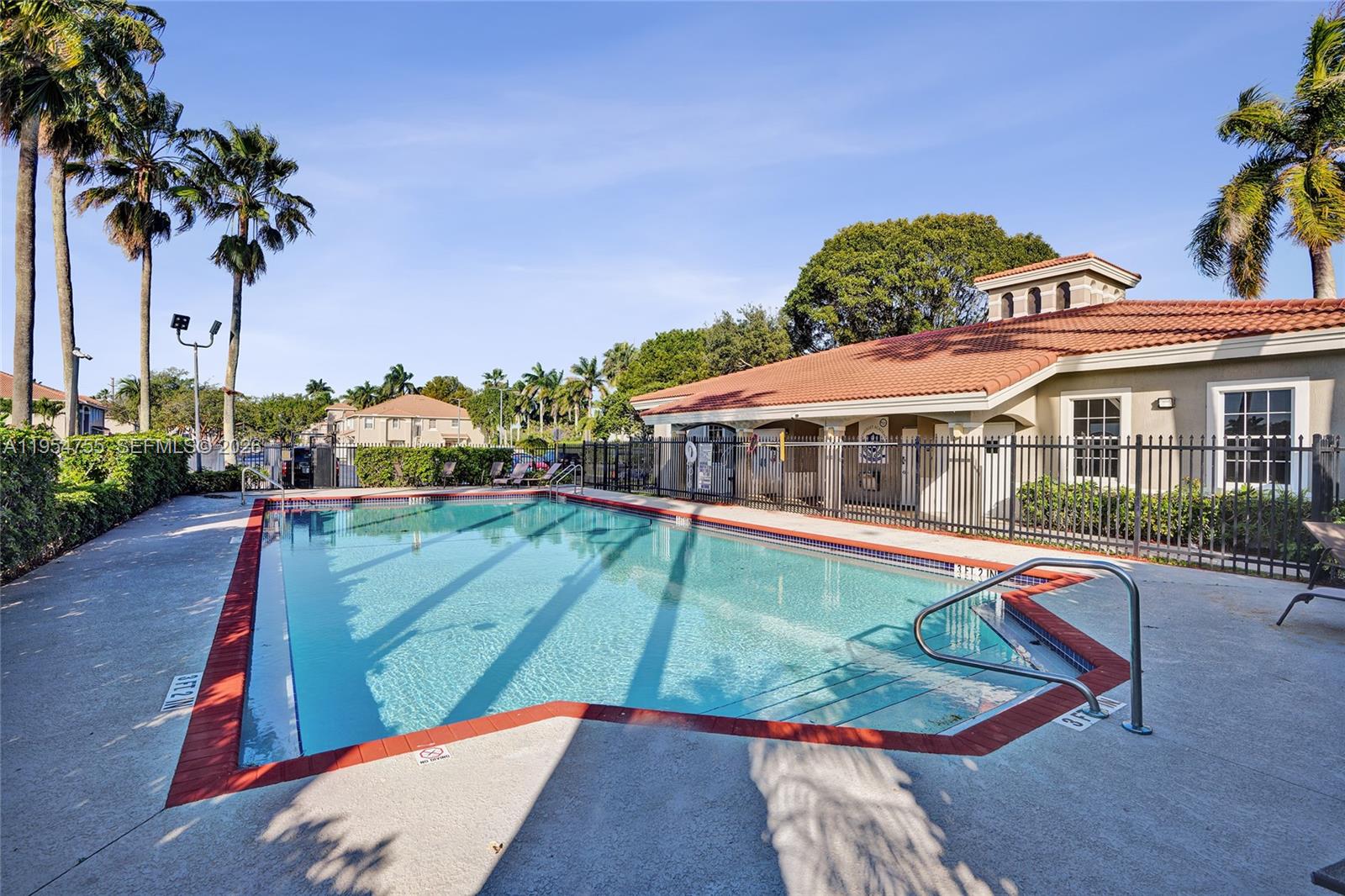 5361 Southwest 125th Avenue Miramar, FL 33027 - Photo 34 of 38 swimming pool view with a garden space