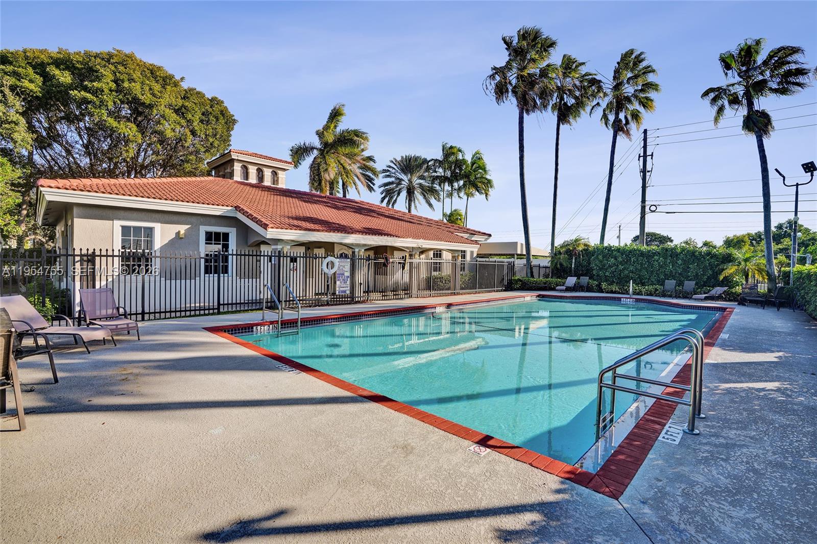 5361 Southwest 125th Avenue Miramar, FL 33027 - Photo 35 of 38 a view of a house with a swimming pool