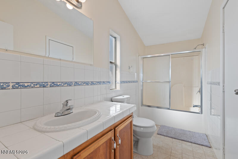 2575 Tonopah Street Silver Springs, NV 89429 - Photo 13 of 22 a bathroom with a sink a toilet and shower