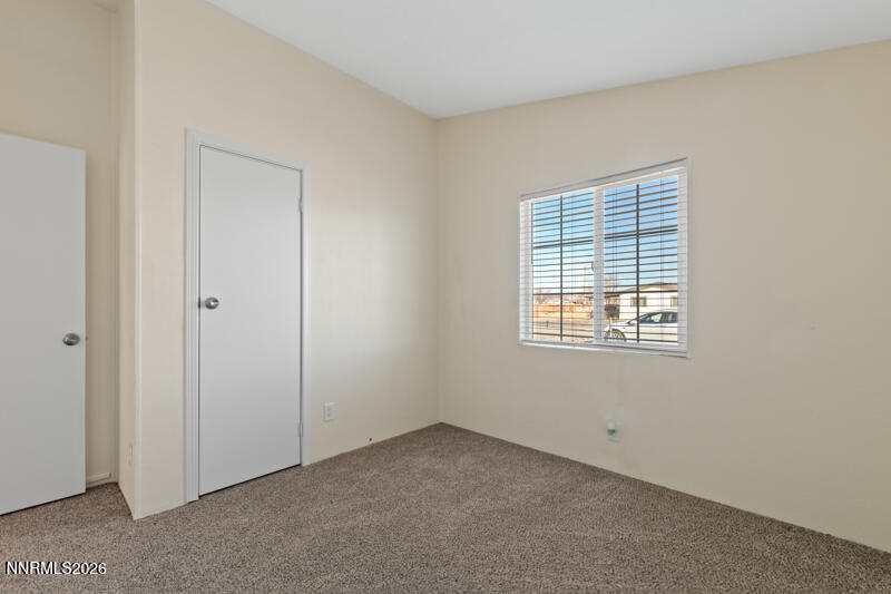 2575 Tonopah Street Silver Springs, NV 89429 - Photo 15 of 22 a view of an empty room with a window