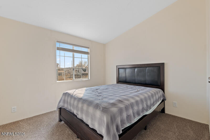 2575 Tonopah Street Silver Springs, NV 89429 - Photo 17 of 22 a bedroom with a bed and window