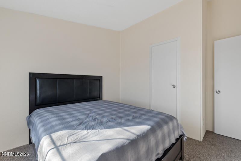 2575 Tonopah Street Silver Springs, NV 89429 - Photo 18 of 22 a bedroom with a bed and a dresser