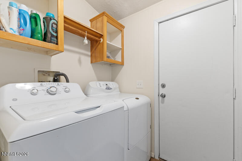 2575 Tonopah Street Silver Springs, NV 89429 - Photo 19 of 22 a utility room with dryer and washer