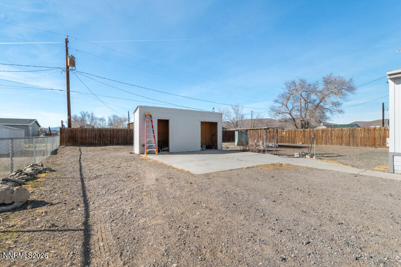 2575 Tonopah Street Silver Springs, NV 89429 - Photo 20 of 22 a view of a house with a backyard
