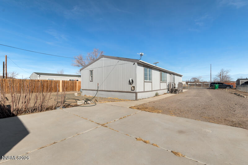 2575 Tonopah Street Silver Springs, NV 89429 - Photo 4 of 22 a view of a house with a backyard