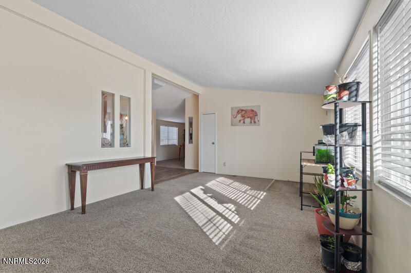 2575 Tonopah Street Silver Springs, NV 89429 - Photo 6 of 22 a view of an empty room with window and hardwood floor