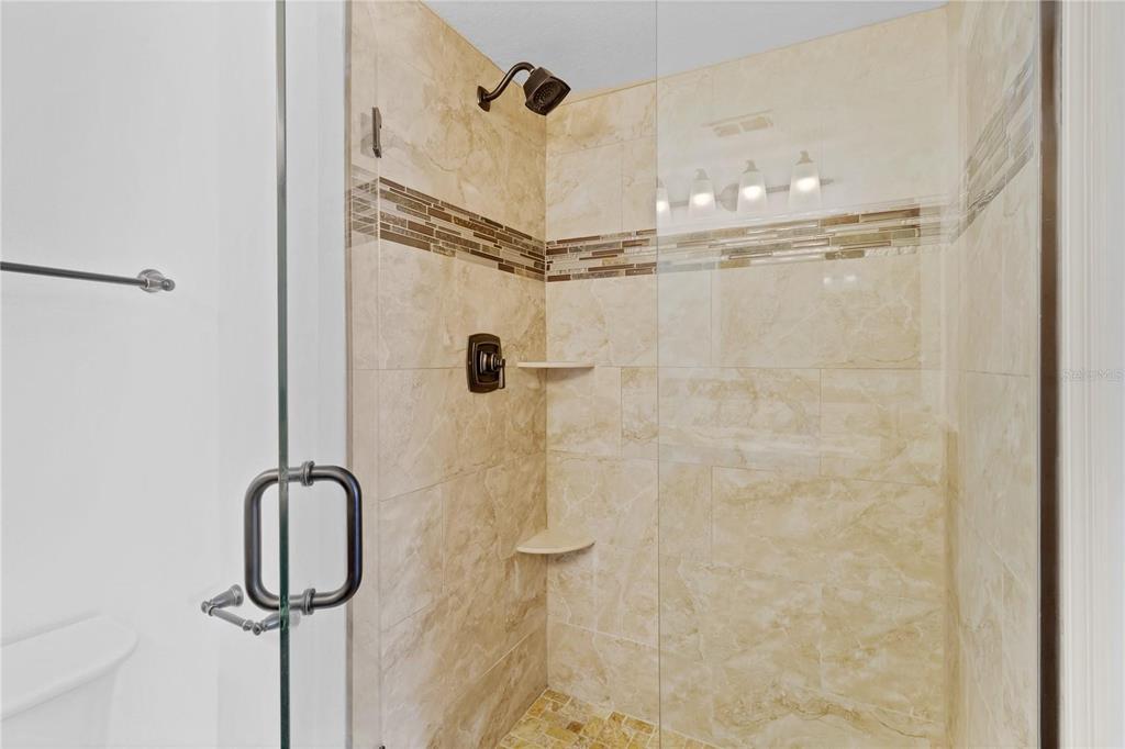 1705 Ridgemoor Drive Mascotte, FL 34753 - Photo 16 of 53 a bathroom with a shower