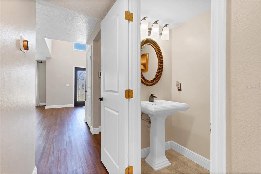 1705 Ridgemoor Drive Mascotte, FL 34753 - Photo 17 of 53 a bathroom with a sink and a mirror