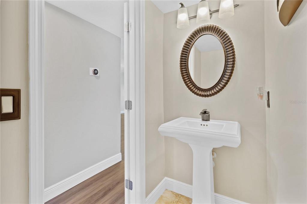 1705 Ridgemoor Drive Mascotte, FL 34753 - Photo 18 of 53 a bathroom with a sink and a mirror