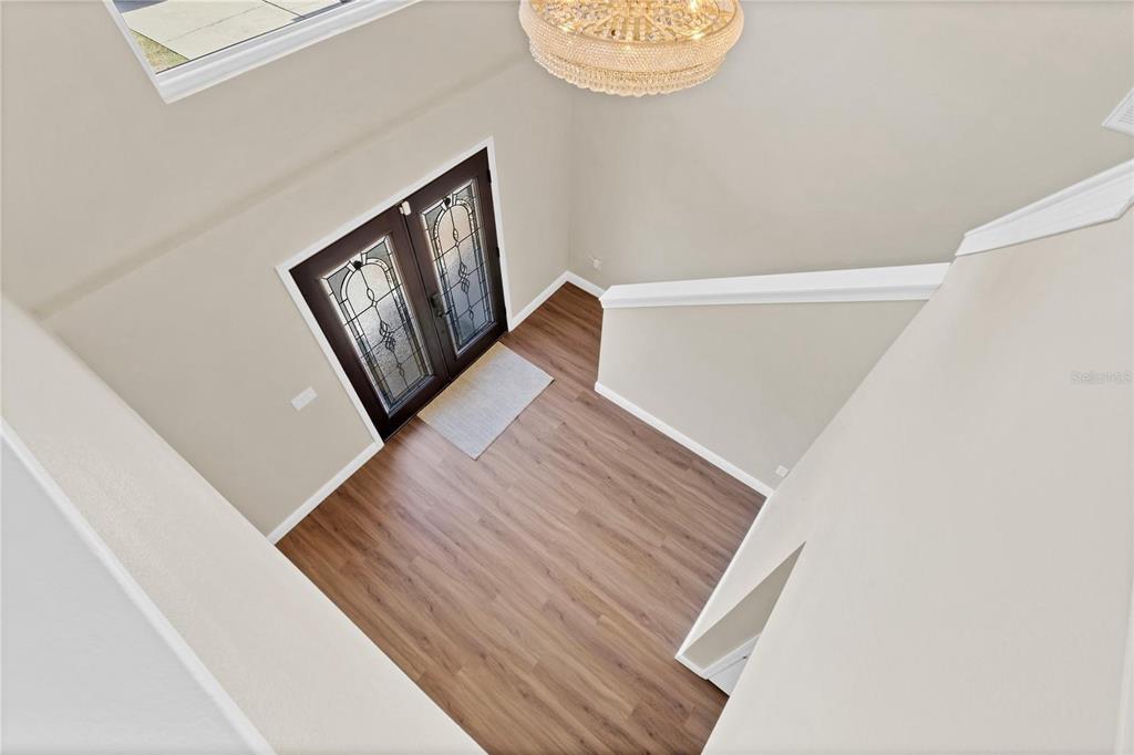1705 Ridgemoor Drive Mascotte, FL 34753 - Photo 20 of 53 a view of a hallway with wooden floor