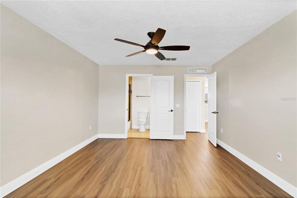 1705 Ridgemoor Drive Mascotte, FL 34753 - Photo 25 of 53 a view of empty room with wooden floor