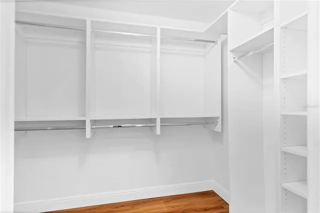 a spacious bathroom with a double vanity sink and a mirror