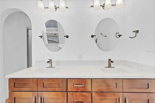 a bathroom with a shower and a glass door