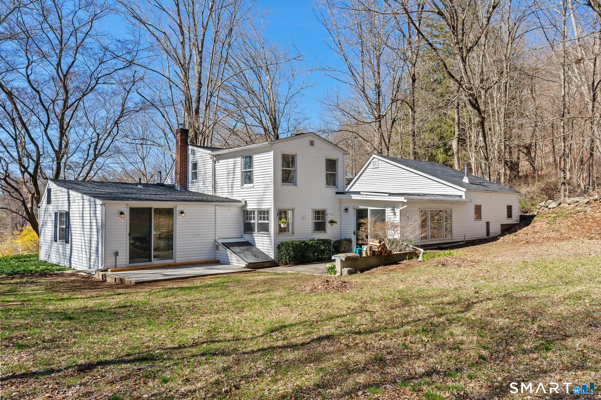 128 Machine Shop Hill Road Windham, CT 06266 - Photo 25 of 45 a view of a house with a yard covered in snow