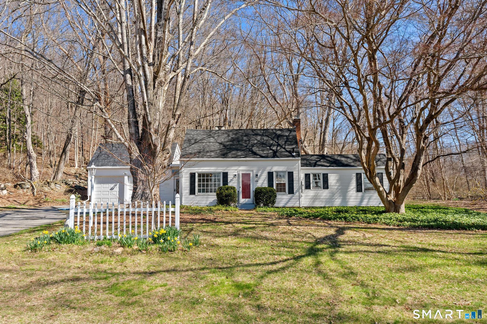 128 Machine Shop Hill Road Windham, CT 06266 - Photo 3 of 45 a front view of a house with a garden