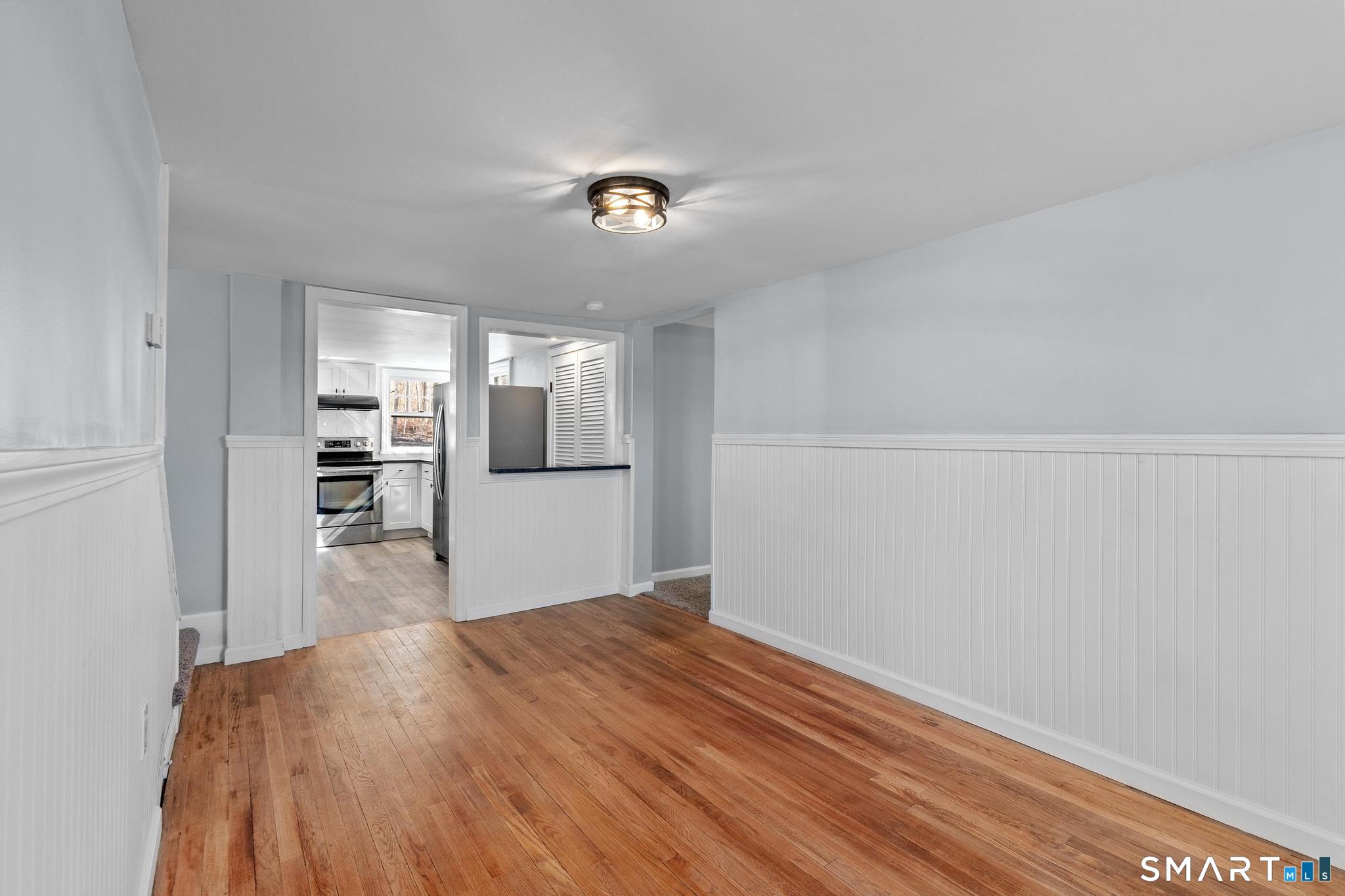 128 Machine Shop Hill Road Windham, CT 06266 - Photo 40 of 45 a view of a kitchen with wooden floor and a kitchen