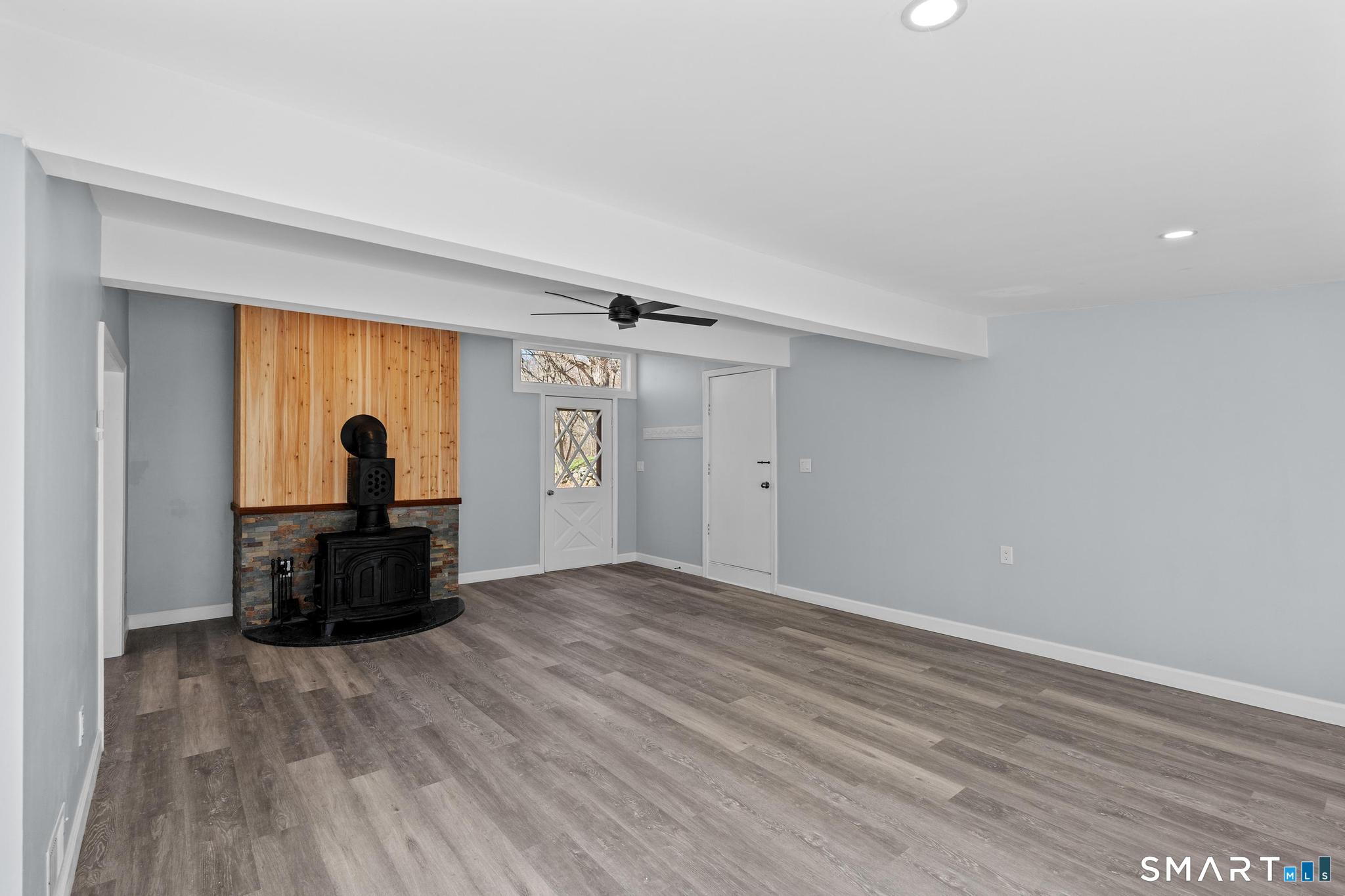 128 Machine Shop Hill Road Windham, CT 06266 - Photo 41 of 45 a view of a livingroom with wooden floor and furniture