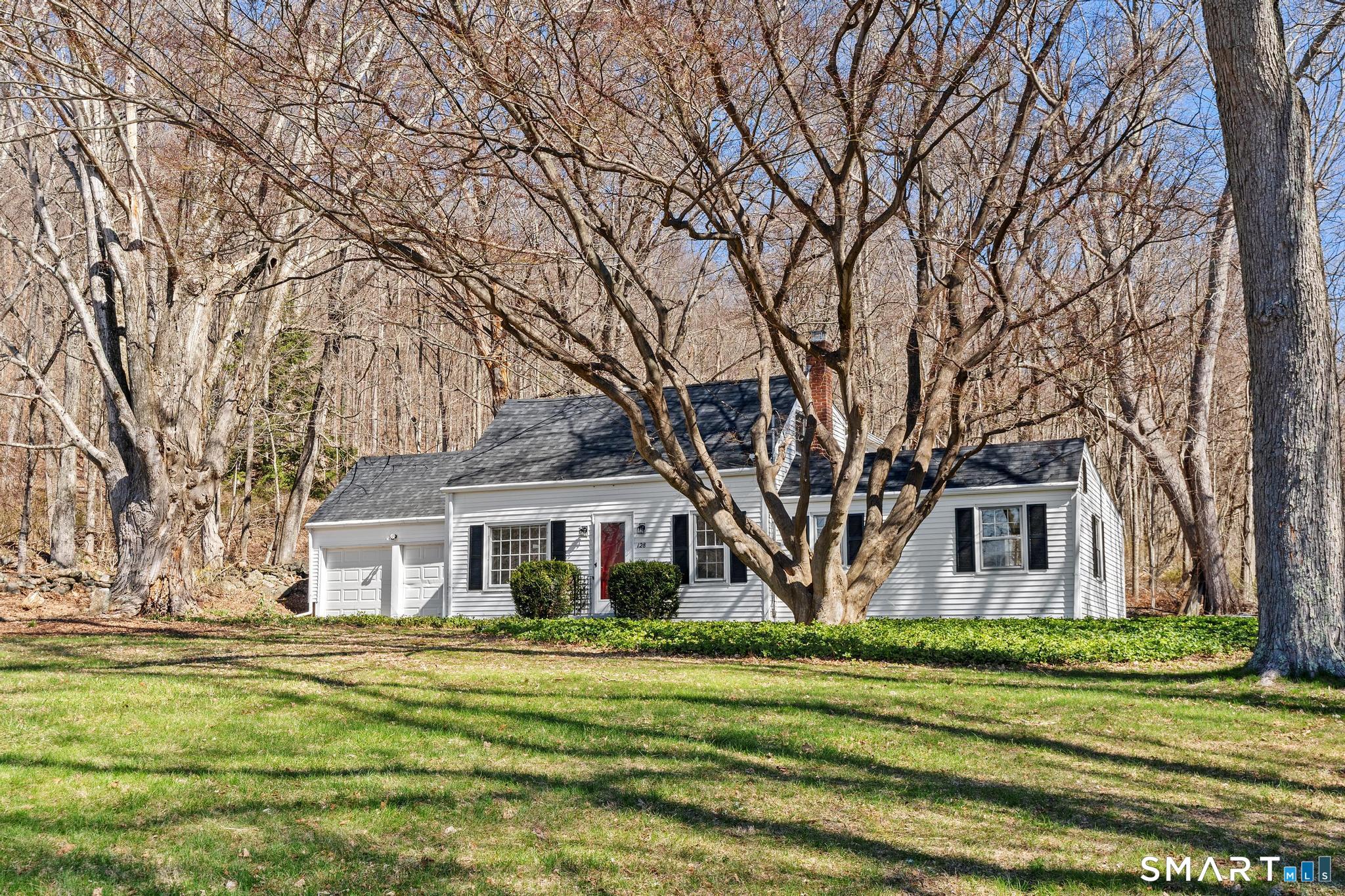 128 Machine Shop Hill Road Windham, CT 06266 - Photo 44 of 45 a front view of a house with a garden