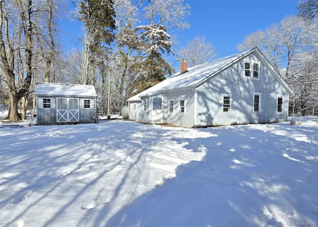 a view of house with yard