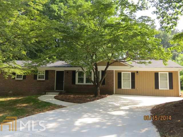 3190 Ridgecrest Drive, Unit 7 Powder Springs, GA 30127 - Photo 1 of 1 a view of a yard in front of a house with large tree