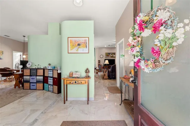 a bedroom with furniture and a potted plant
