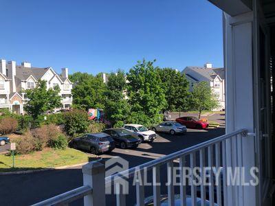 31 Edinburgh Court Edison, NJ 08820 - Photo 16 of 25 a view of a porch with furniture and a yard
