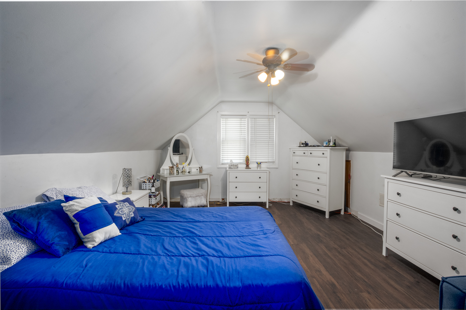 5328 South Harding Avenue Chicago, IL 60632 - Photo 13 of 26 a living room with furniture and a flat screen tv