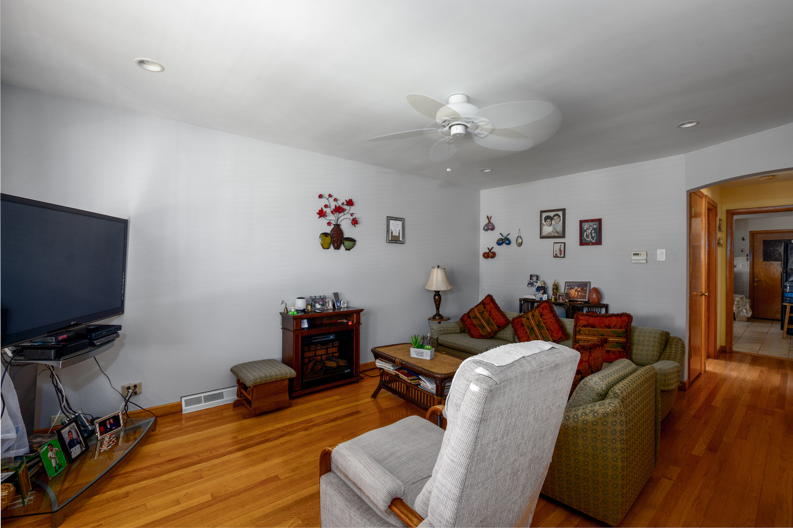 5328 South Harding Avenue Chicago, IL 60632 - Photo 4 of 26 a living room with furniture and a flat screen tv