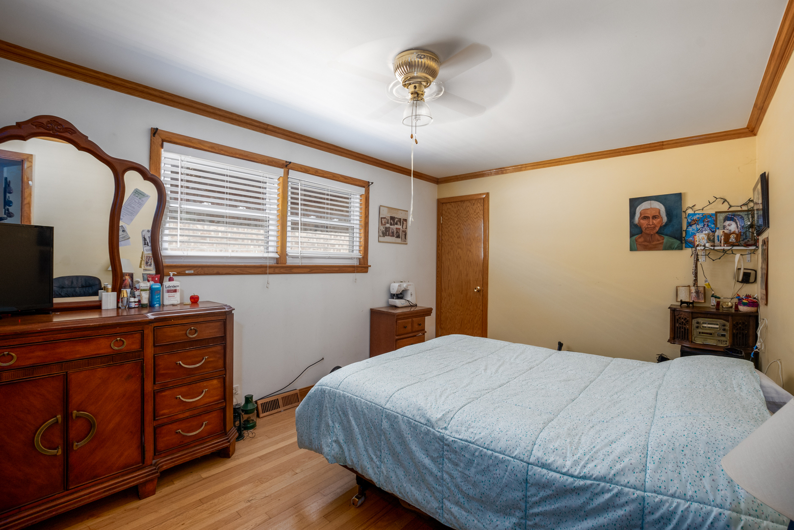 5328 South Harding Avenue Chicago, IL 60632 - Photo 6 of 26 a bedroom with a bed and wooden floor