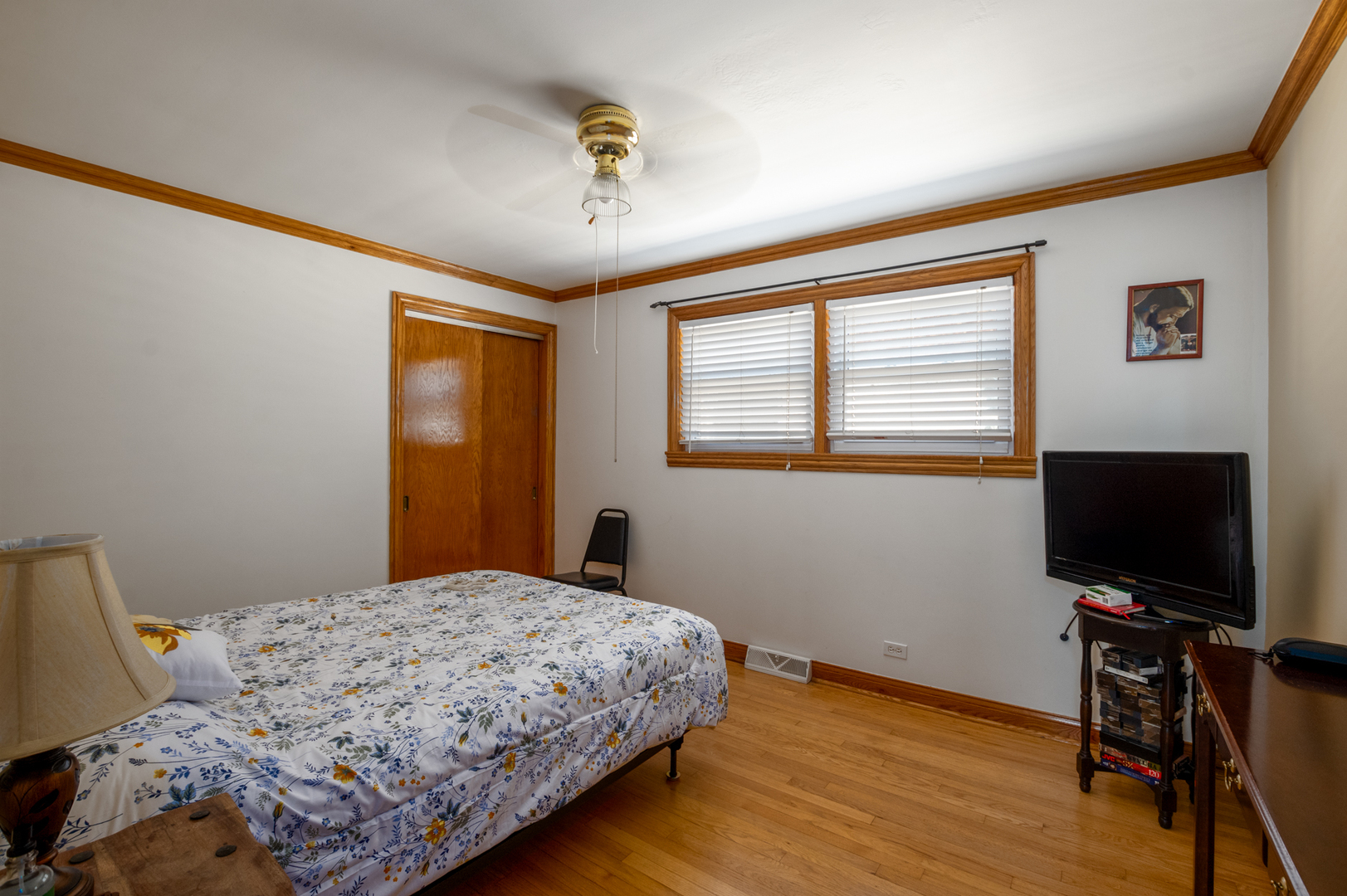 5328 South Harding Avenue Chicago, IL 60632 - Photo 7 of 26 a bedroom with a bed and a flat screen tv