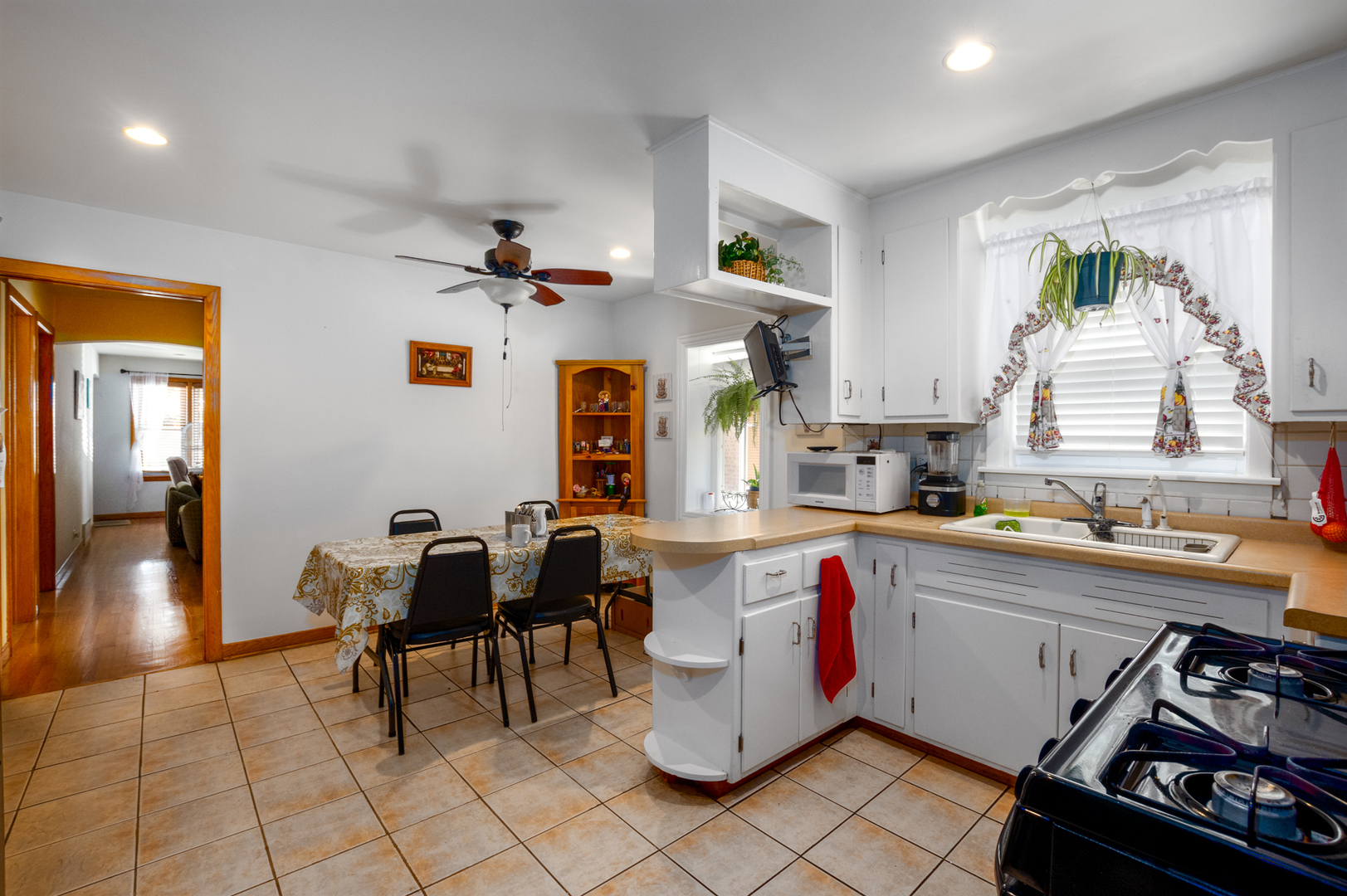 5328 South Harding Avenue Chicago, IL 60632 - Photo 10 of 26 a kitchen with a sink and a stove top oven