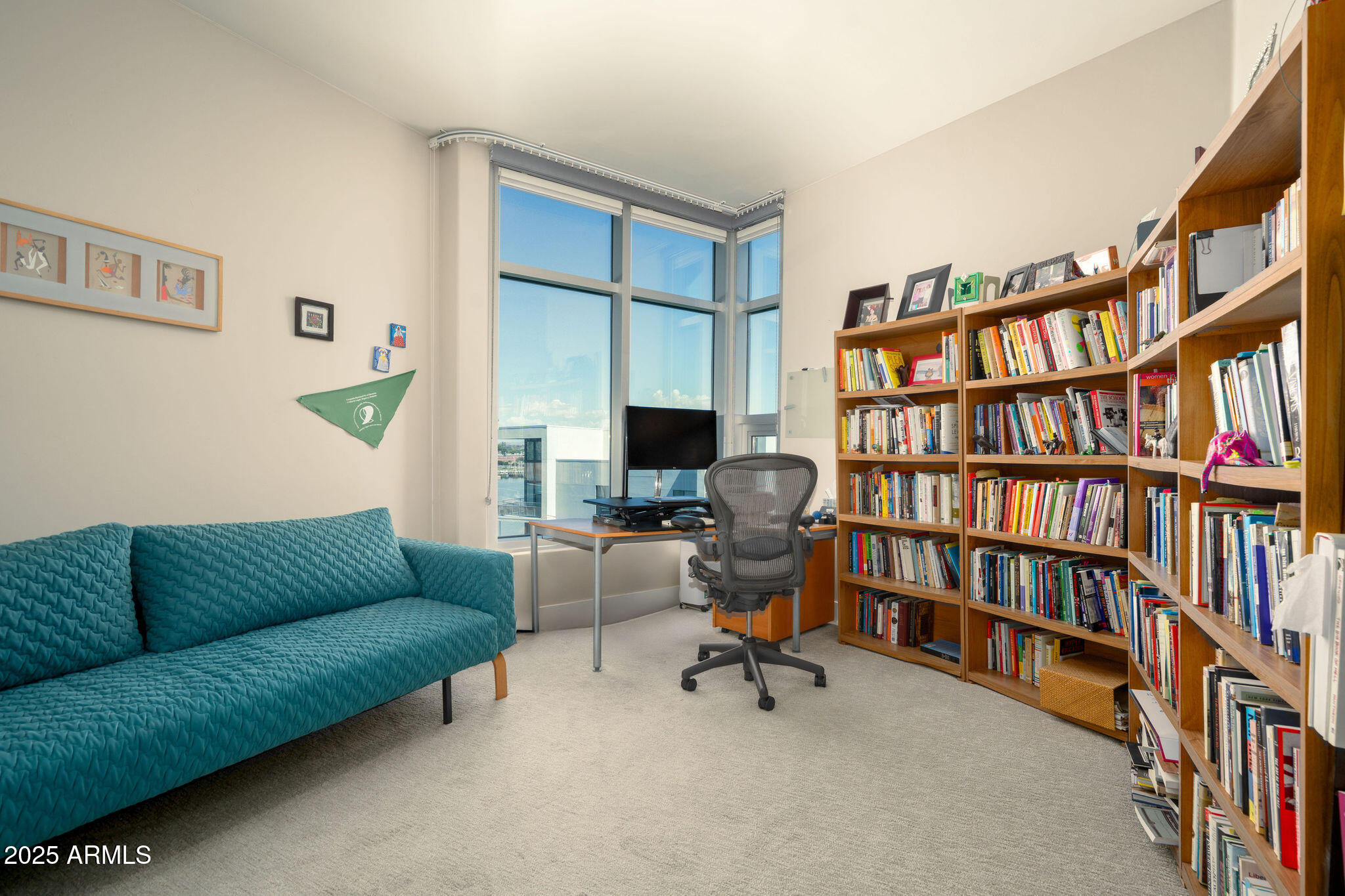 140 East Rio Salado Parkway, Unit 509 Tempe, AZ 85281 - Photo 11 of 43 a living room with furniture and a book shelf