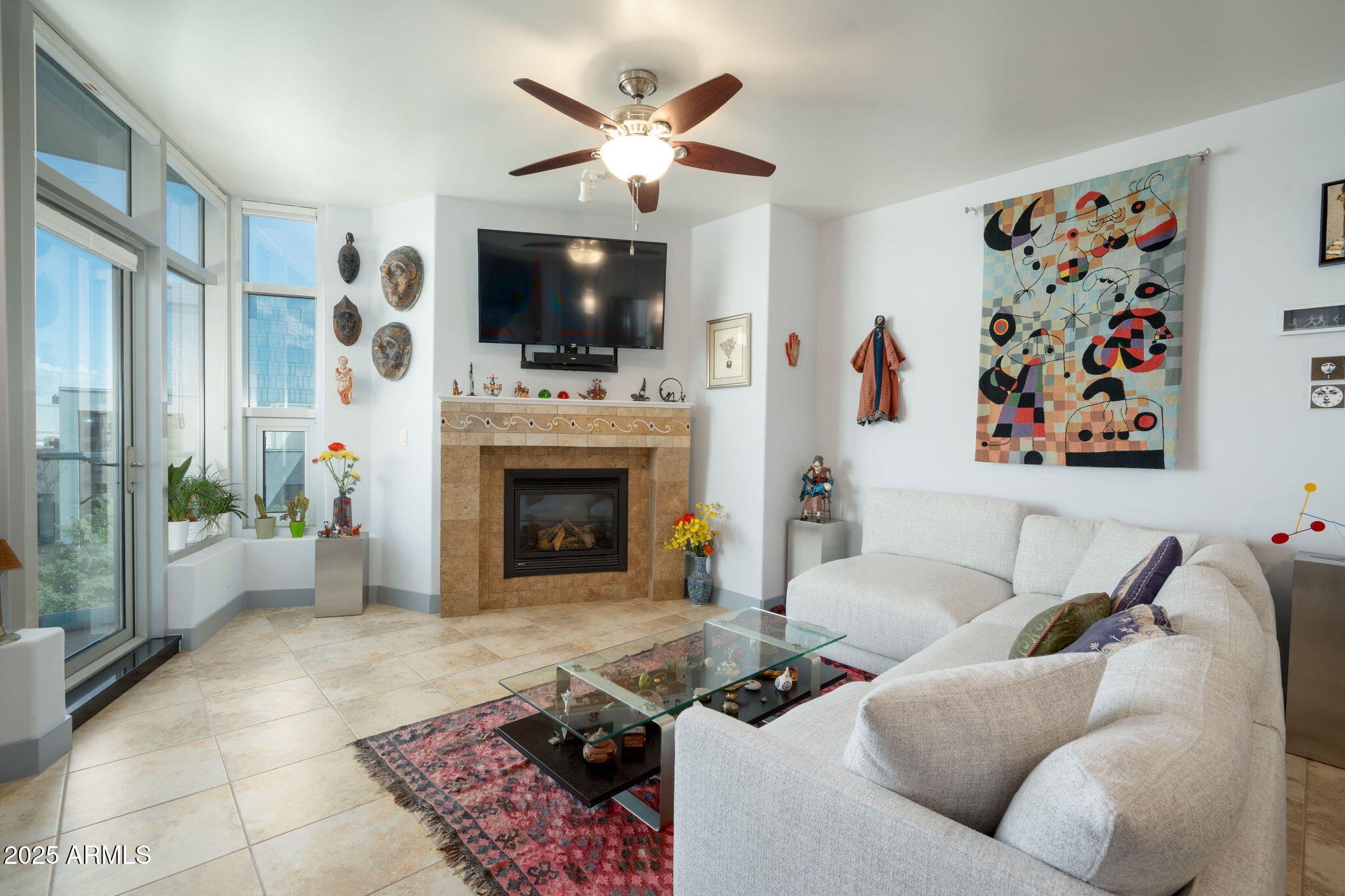 140 East Rio Salado Parkway, Unit 509 Tempe, AZ 85281 - Photo 13 of 43 a living room with furniture a flat screen tv and a fireplace
