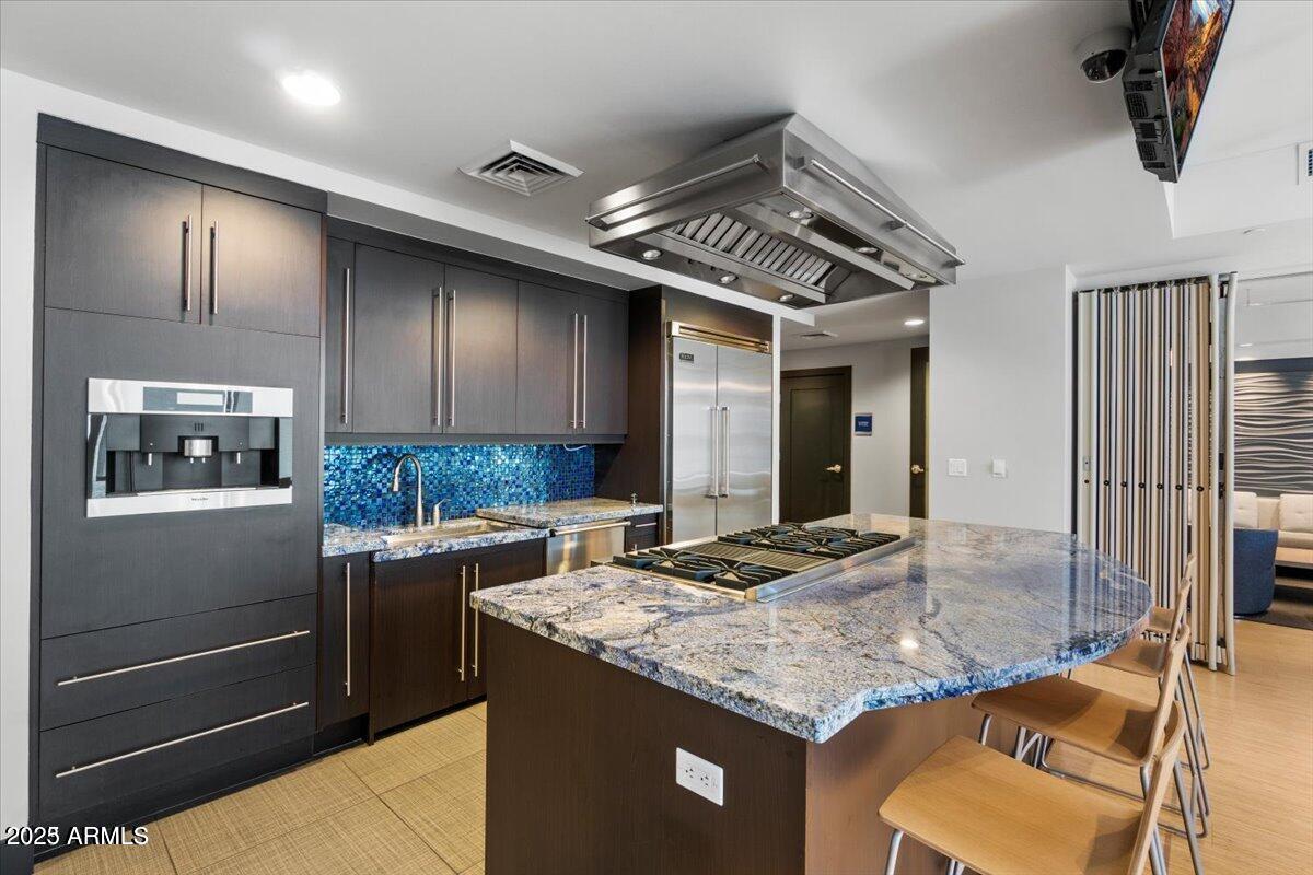 140 East Rio Salado Parkway, Unit 509 Tempe, AZ 85281 - Photo 35 of 43 a kitchen with granite countertop stainless steel appliances and wooden cabinets