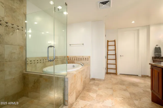 a bathroom with a bathtub and a sink