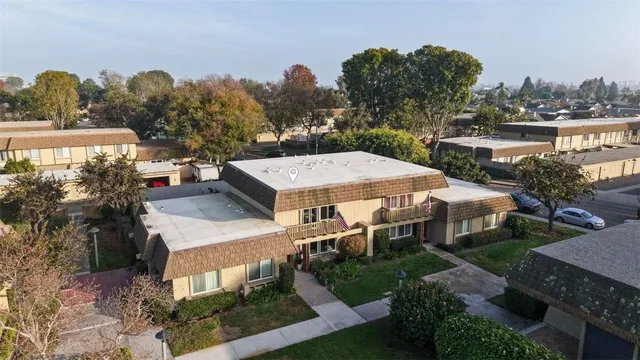 an aerial view of a house with a garden